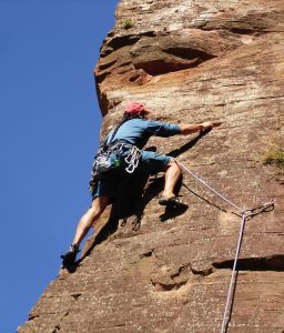 Life is a Challenge - Man Rock Climbing